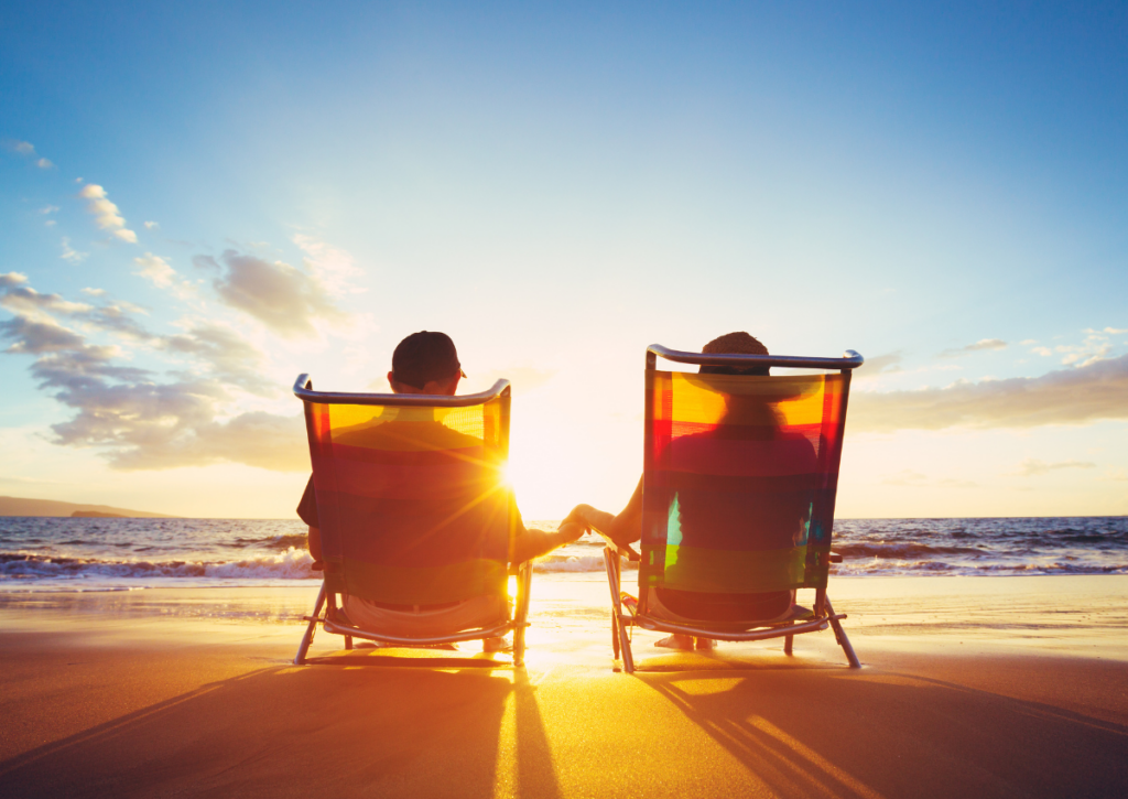 couple holding hands on the beach