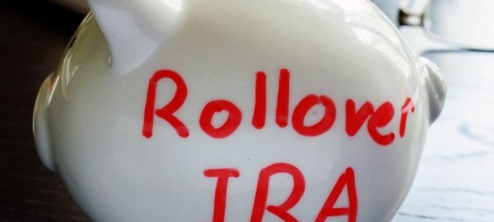 Piggy bank with the words 'rollover IRA' written on it